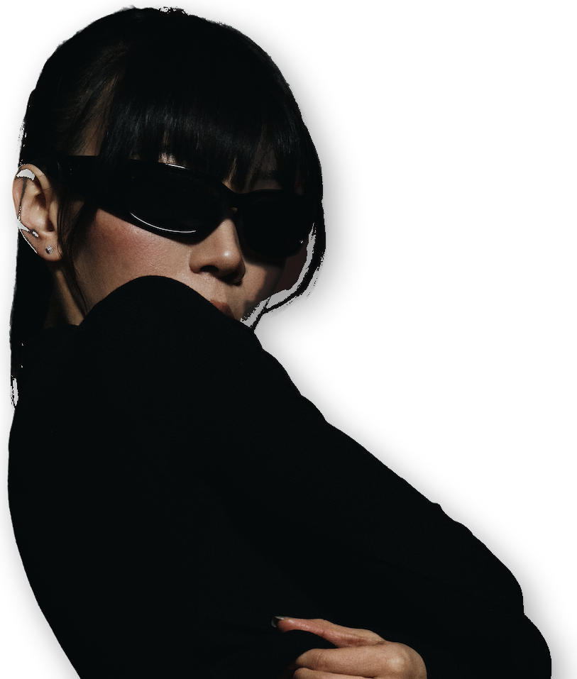 Portrait of Jade in sunglasses, arms crossed